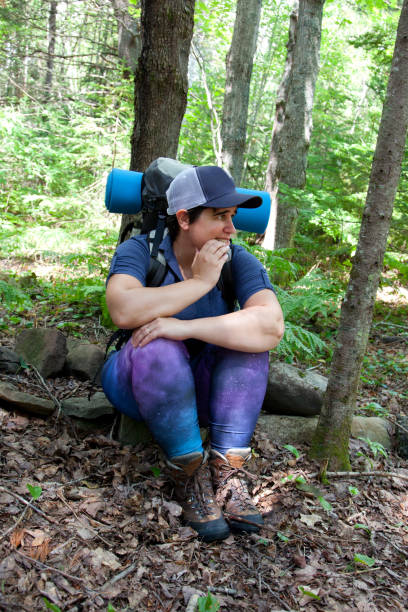 Worried Woman Has Become Lost Or Afraid In The Woods While Hiking